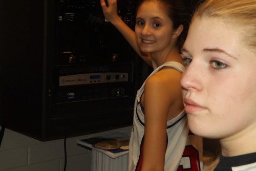 Wolf freshmen Carlie Rosenkrance (left) and Tiffany Briscoe fire up the sound system. (Amy Briscoe photos)
