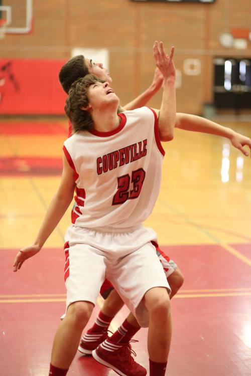 Isaac Vargas gets wrapped up in fighting for a rebound.