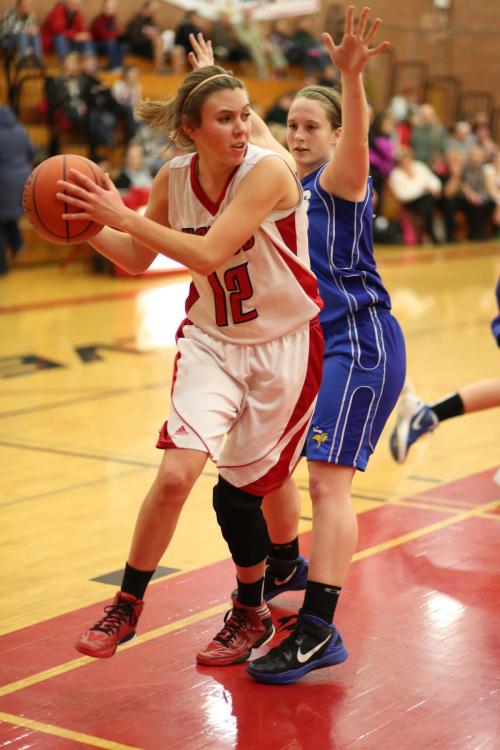 Julia Myers looks for an open teammate while trying to break a press.