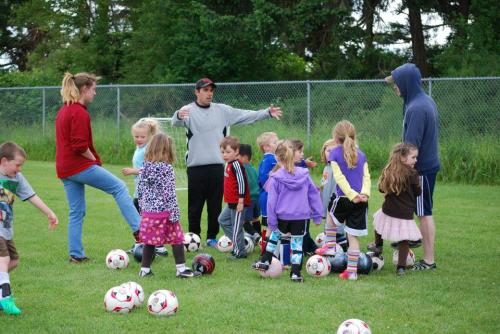 CHS star Jacki Ginnings (left, in red) and GU18 Whidbey Islanders coach Sean LeVine (Kali Barrio photo)