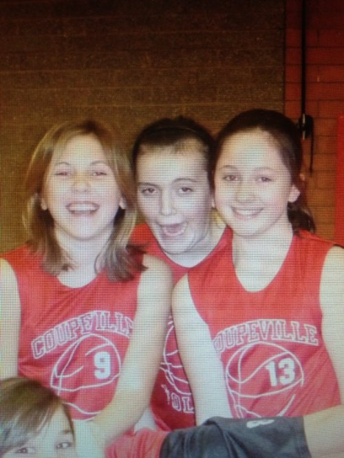 Myers and McKayla Bailey (right) are photobombed by Hailey Hammer, before the word photo bomb was used.