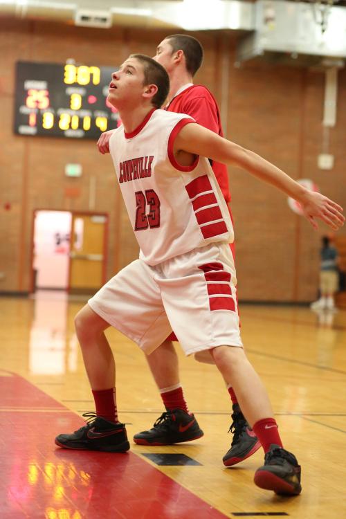 Isaac Vargas gets his body in between an opposing player and a potential rebound.