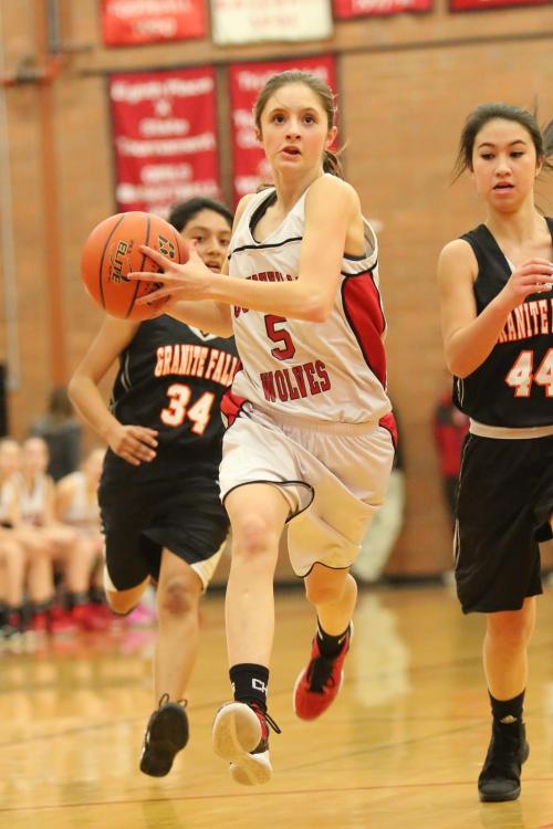 Rosenkrance, who has moved up to varsity full-time for the playoffs, drives hard to the hoop in a JV game.