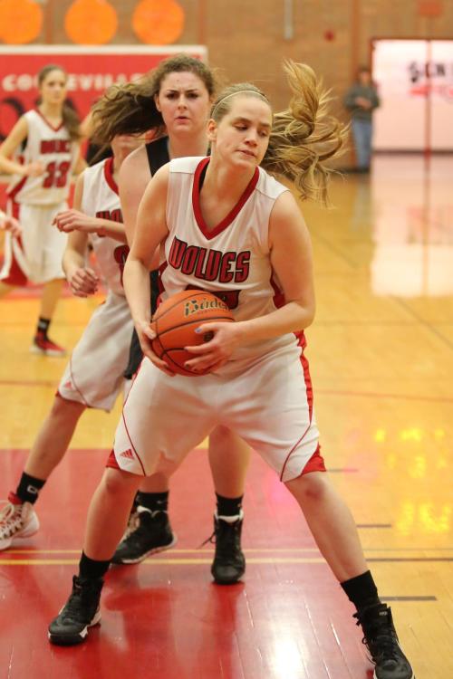 Monica Vidoni snatches a rebound away from a Granite Falls player.
