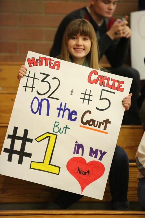 CHS freshman Valen Trujillo cheers on Mattea Miller and Carlie Rosenkrance.