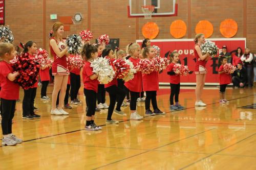 Wolf cheerleaders Shelby Hall (left, red hair) and Ally Roberts