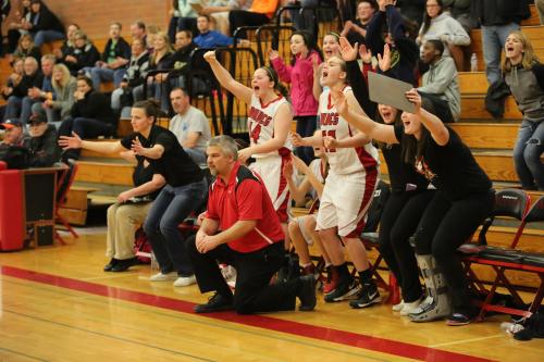 Wolf coach David King (in red) remains the only calm person in the gym. (John Fisken photos)