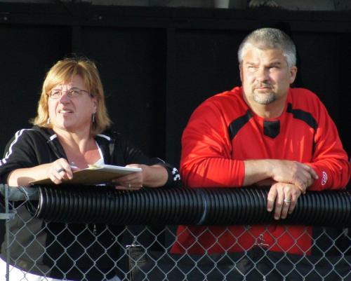 Softball coaches Amy and David King survey the action last season. (Shelli Trumbull photo)