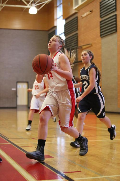 Sage Renninger goes hard to the hoop.