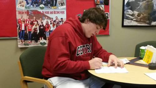 Nick Streubel puts autograph to paper Wednesday morning. (Amanda Streubel photo)