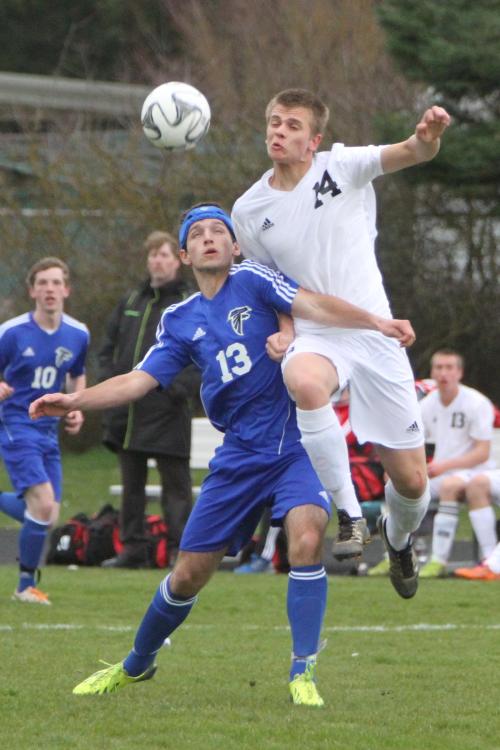 Jared Dickson (right) goes high as he fights for a ball. (John Fisken photos)