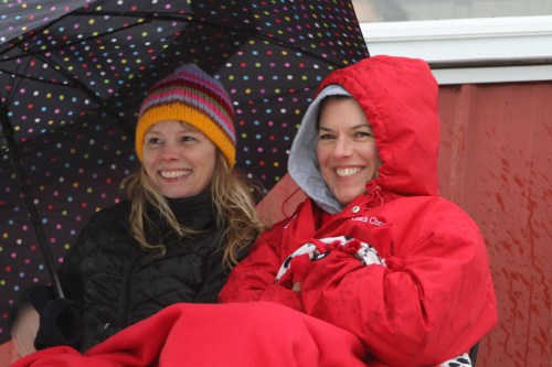Devoted soccer moms Janine Bundy (left) and Cheridan Eck hunker down on a balmy Whidbey afternoon.