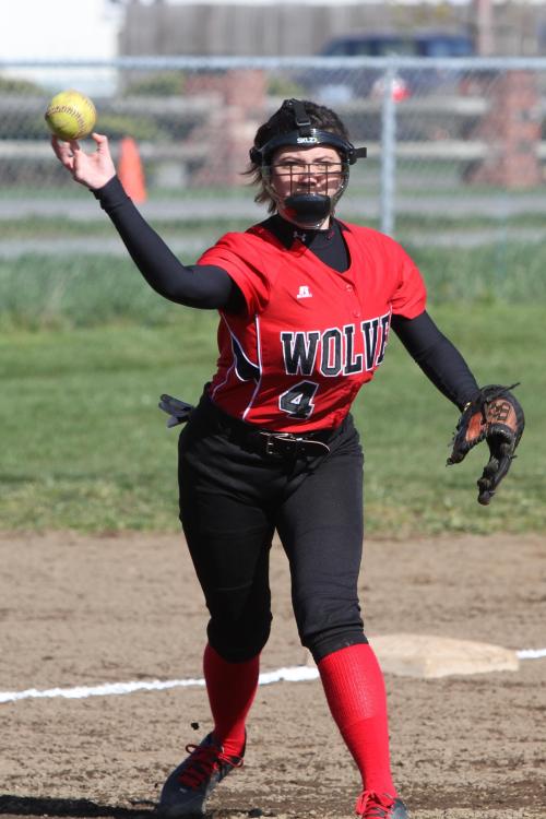 Wolf third-baseman Emily Licence comes up firing. (John Fisken photos)