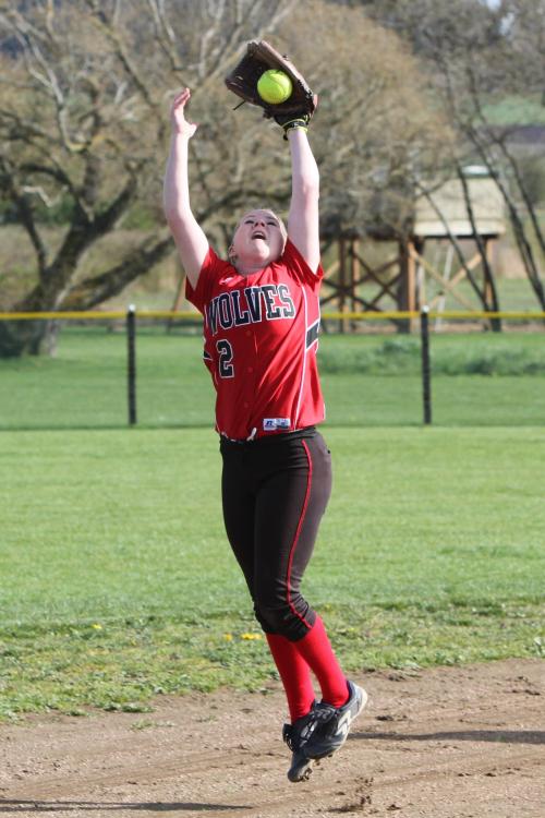 Madeline Roberts jumps out of her shoes to spear a liner at short. (John Fisken photos)