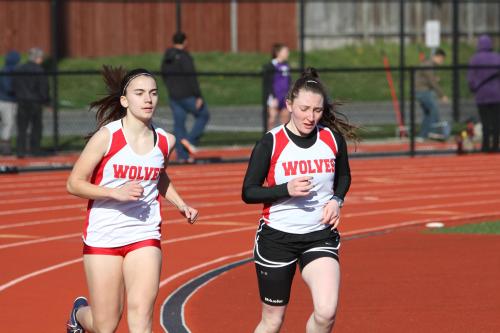 Mattea Miller (left) and Erin Rosenkranz pace the Wolves in the distance races.