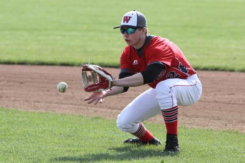 Josh Bayne goes low to make the play.