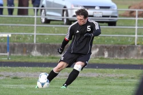 Brett Arnold clears the ball from Coupeville's half of the field.
