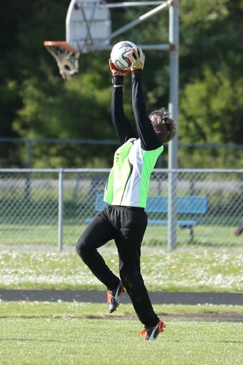 Connor McCormick goes high for the stop. (John Fisken photos)
