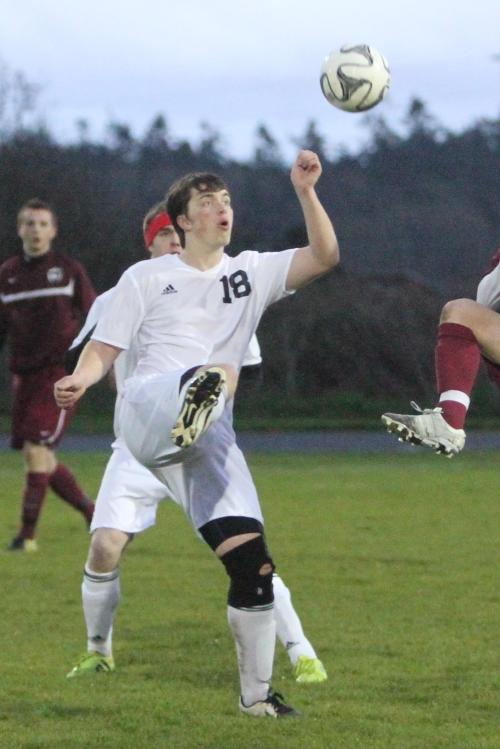 Keegan Korteum (18) and Gunnar Langvold (red headband) battle for CHS earlier this season. (John Fisken photo)