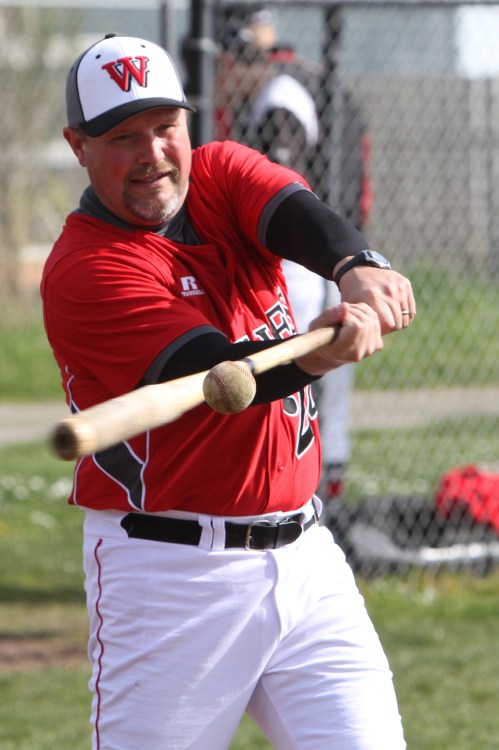 CHS coach Willie Smith, seen here hitting fungoes, was not in a chatty mood after Friday's loss. (John Fisken photo)