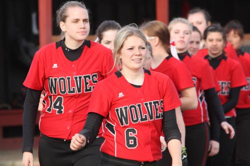 The Wolves, led by Breeanna Messner (6) and Monica Vidoni, head out to congratulate Granite Falls.