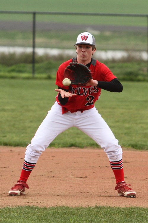 Cole Payne fields a chopper at third.