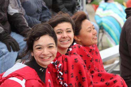 Not event the wind and cold could slow down CHS softball players (l to r) Robin Cedillo, Emily Licence and Erin Josue, who hooted and hollered for their fellow freshmen. (JOhn Fisken photos)