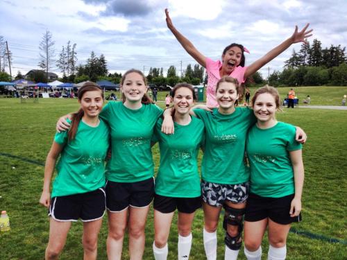 Becca Pabona photobombs her Whidbey Islanders teammates (l t r, Micky LeVine, Jenn Spark, Kendra Warwick, ? Fields, Paige Waterman). (Kali Barrio photo)