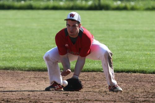 Ben Etzell goes low to snag a ball. (John Fisken photo)