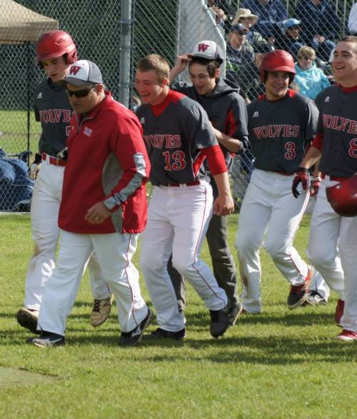 The Wolves celebrate after Jake Tumblin's home run. (Shelli Trumbull photos)