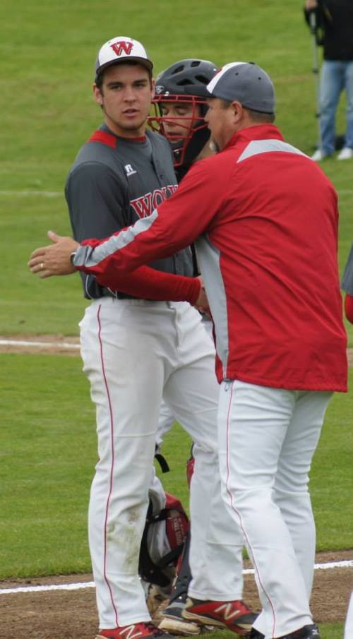 Wolf baseball guru Willie Smith congratulates pitcher Ben Etzell. (Shelli Trumbull photo)