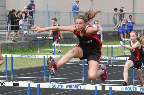 Lindsey Roberts explodes over a hurdle.