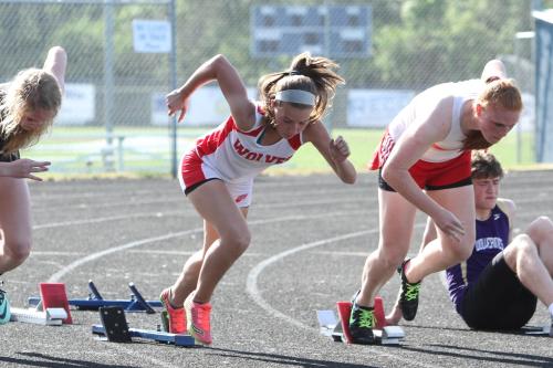 Sylvia Hurlburt (center) explodes out of the blocks.