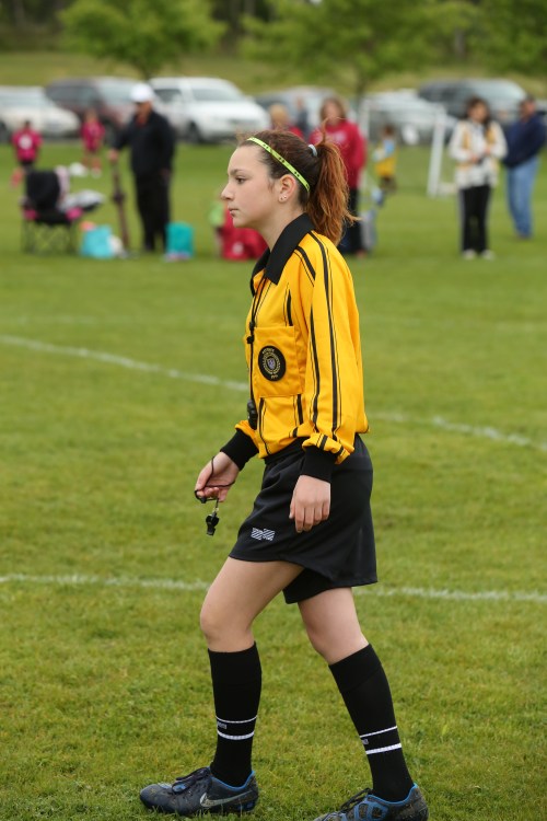 Coupeville Middle School track star Kalia Littlejohn patrols the soccer field as a certified, uniform-wearing ref. (John Fisken photos)
