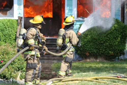Firefighters develop their hose skills.