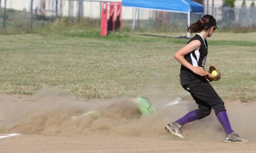 Somewhere inside the dust storm is Bella Northup, who safely made it back to third.