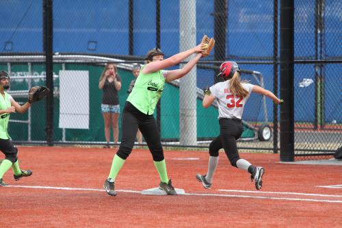 Crownover hauls in a throw at first, beating the runner to the bag.