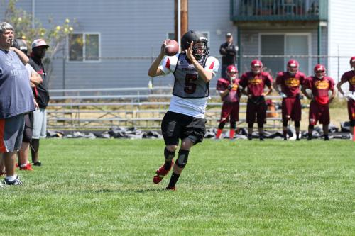 Langvold's successor, Joel Walstad, rolls out to fire a pass.