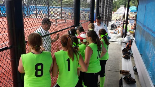 The Venom listen to coach Kevin McGranahan prior to their game. (John Fisken photo)