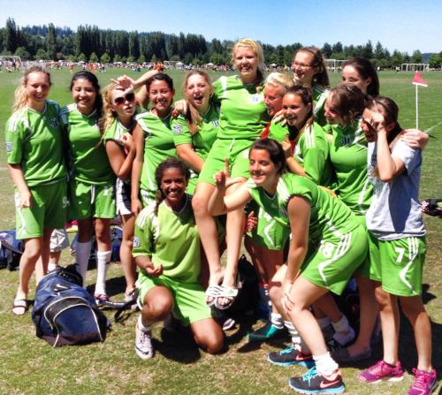 The GU19 Whidbey Islanders hoist Lydia Peplinksi after her goal clinched a tourney title Sunday. (Kali Barrio photos)