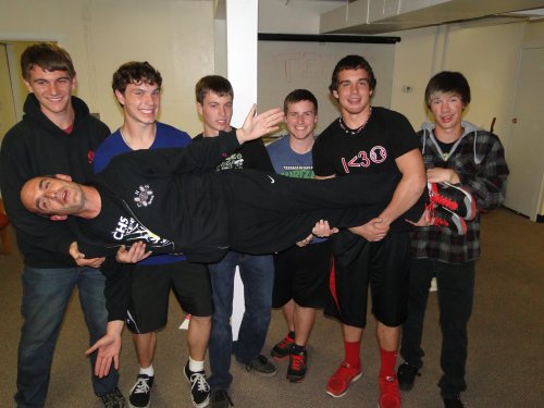 Ken Stange hangs out with his tennis players. (Wendy McCormick photo)