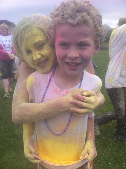 Mckenzie and Caleb Meyer, seen here at an earlier Color Run, show you what's in store for runners Saturday. (Jodi Crimmins photo)