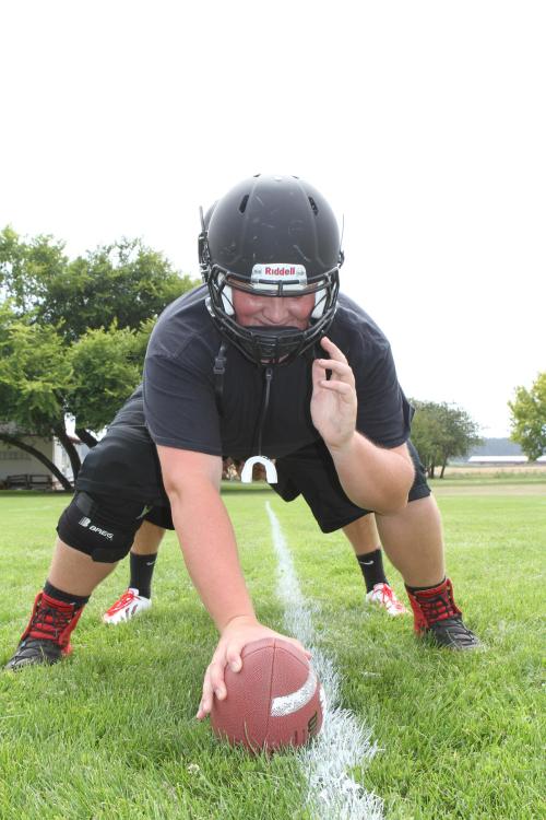 Risner hears the news fellow lineman Oscar Liquidano is returning from Vegas for his senior year and can't hold in his smile.