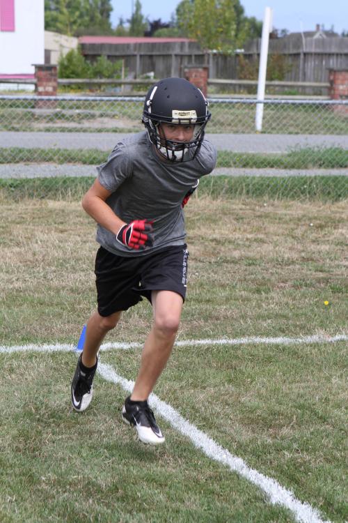 One eye on the field, one eye on the cameraman.