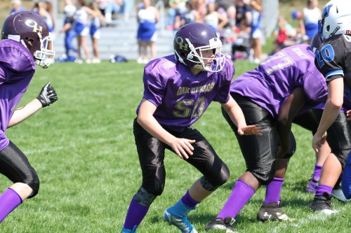 A third Coupeville kid playing for Oak harbor, Alex Turner, holds the line.