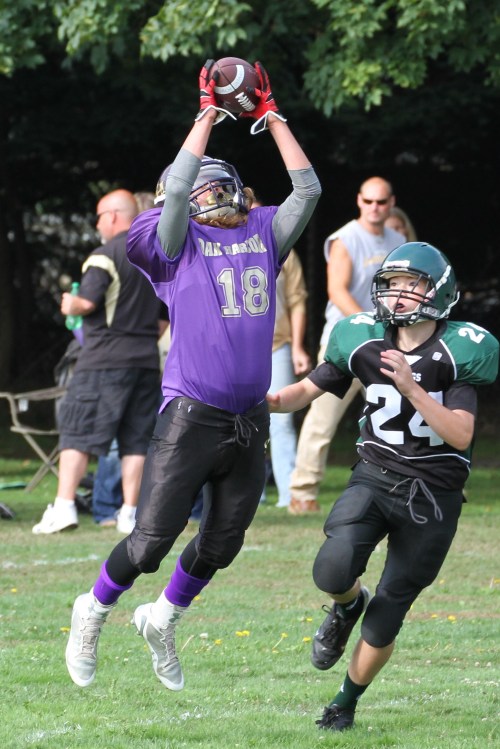 Gabe Eck climbs the ladder and makes off with an interception. (John Fisken photo)
