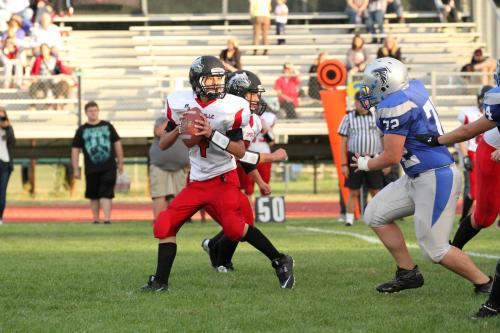 Wolf QB Hunter Smith rolls out under pressure.