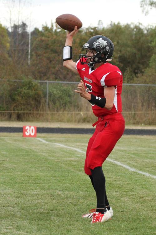 Joel Walstad prepares to flick a short pass over the outstretched fingertips of the Chimacum defense.