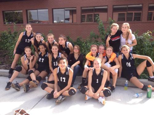 The Wolves enjoy a break from the muggy gym while a fire alarm is checked out. (Amy King photo)