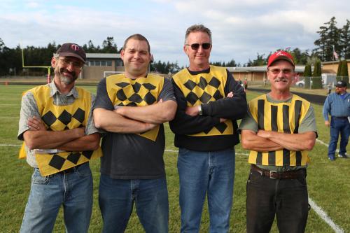 The hardest working chain gang in town are (l to r) Mike Etzell, Lark Gustafson, John Thompson and Randy Payne.